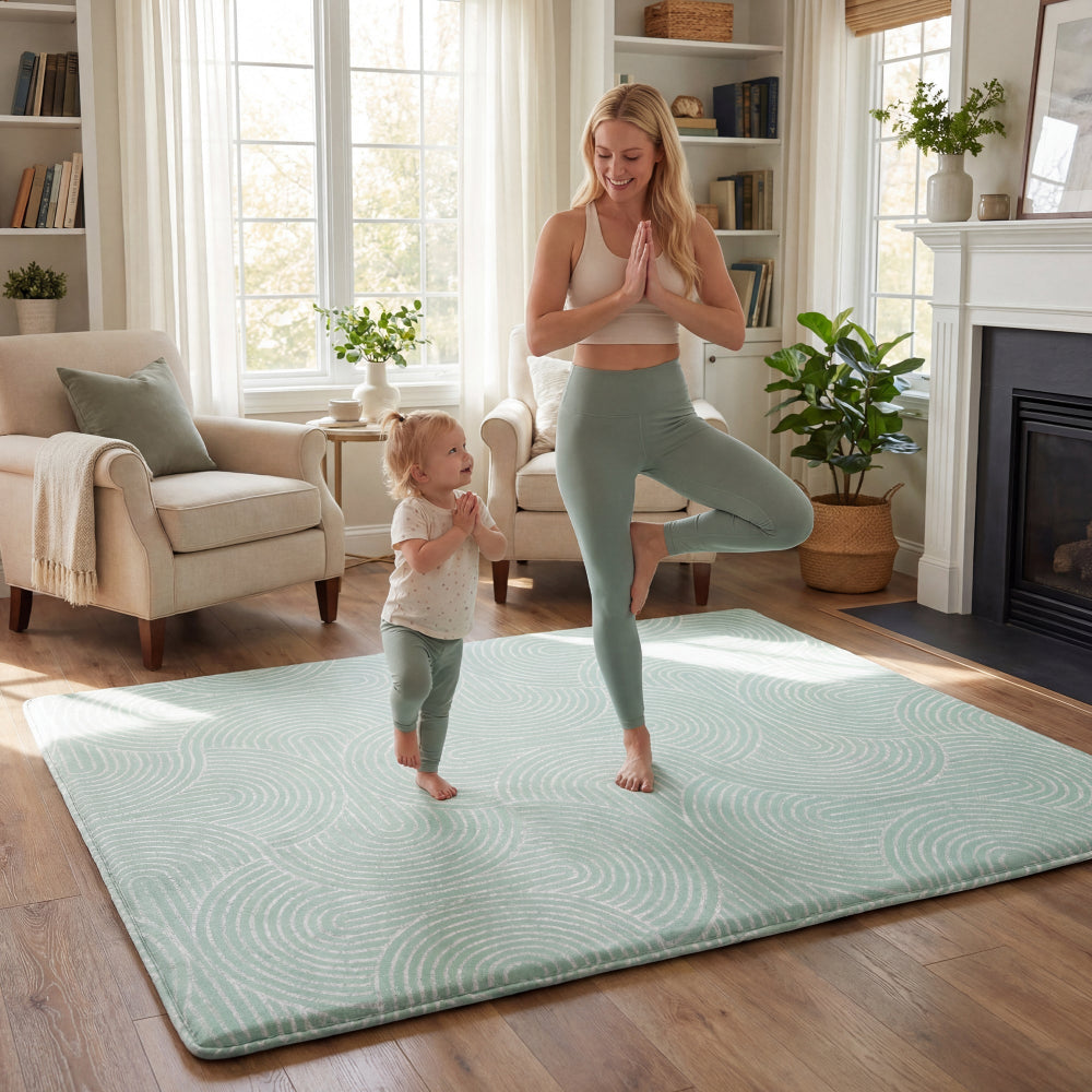 baby playing on sage ivory luna arch geometric Huloosleep play mat nursery